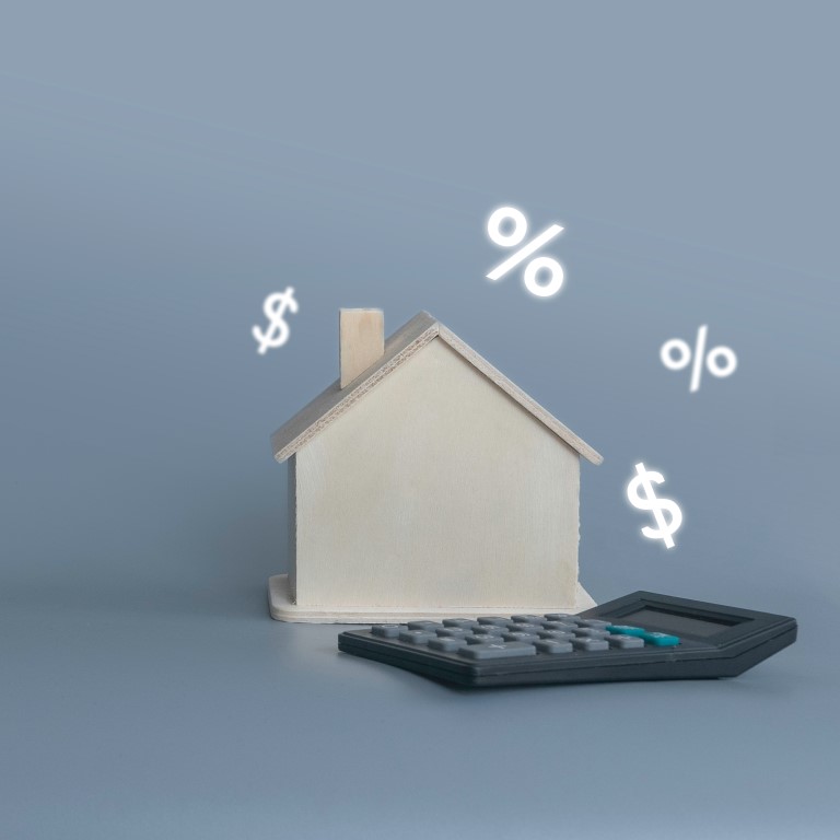 small wooden house with calculator percentage and utc — kopia